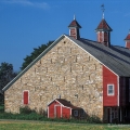 A bank barn with cupolas and a weather vane in Mifflin County, Pennsylvania