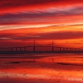 A fiery dawn and the Sunshine Skyway Bridge over Tampa Bay, Florida