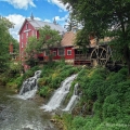 The Clifton Mill, built in the 1820s, rises six stories above the gorge of the Little Miami at the village of Clifton in Greene County.