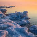 Sunrise along the icy Lake Erie shoreline near the Marblehead Lighthouse in Ottawa County.